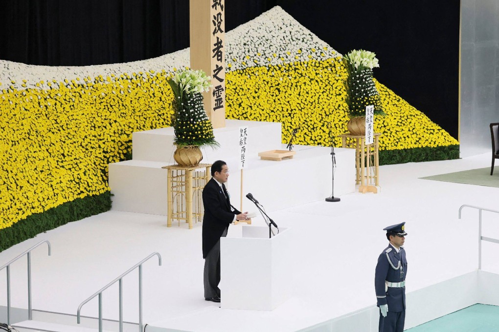 Prime Minister Fumio Kishida (left) delivers a speech during a memorial service for the war dead at Nippon Budokan in Tokyo on Tuesday as Japan observed the 78th anniversary of its World War II defeat. Photo: AFP