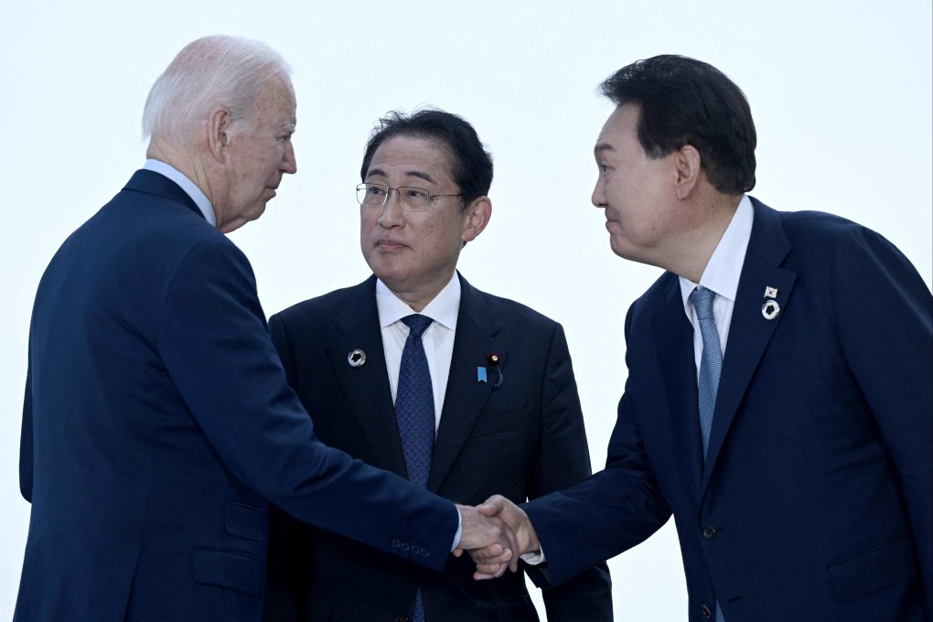 US President Joe Biden (far left) will be hosting Japanese Prime Minister Fumio Kishida (centre) and South Korean President Yoon Suk-yeol at Camp David on Friday. Photo: AFP