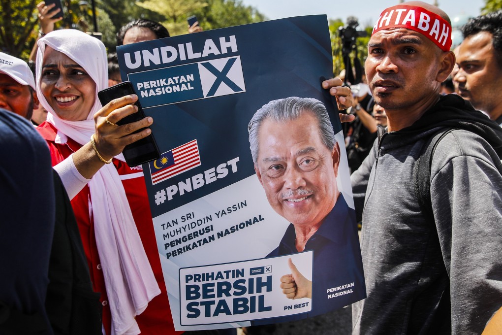 Supporters of Muhyiddin Yassin gather outside Kuala Lumpur High Court on March 10. Muhyiddin still faces three further corruption charges. Photo: EPA-EFE