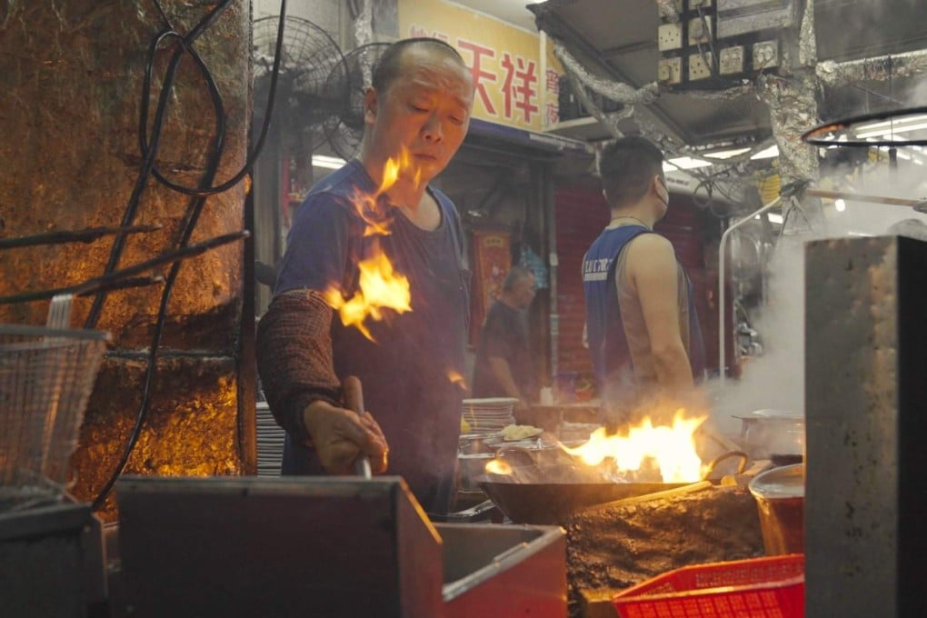 Dai pai dong cooks in Sham Shui Po on May 1. Increasingly, tourists prefer grit to glitter, turning away from modern, large-scale, planned events to seek out small, colourful, organic pockets of local history and culture. Photo: Llewellyn Cheung