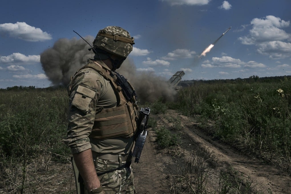 A Ukrainian soldier watches a Grad multiple launch rocket system firing shells with flyers near Bakhmut, Ukraine, on August 13. Photo: AP