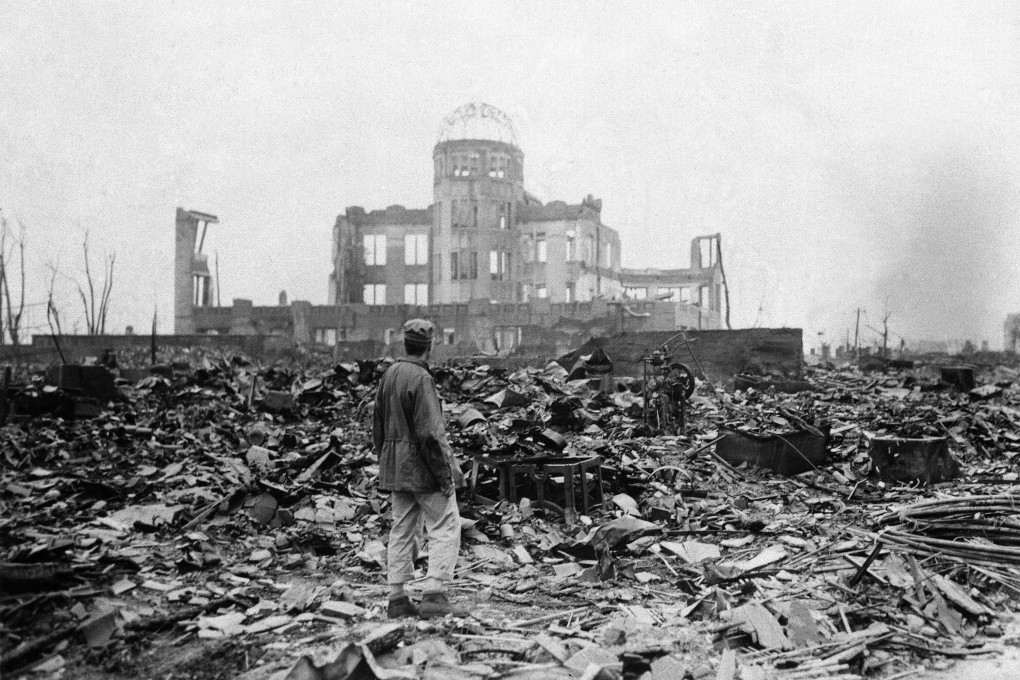 An Allied correspondent stands in a sea of rubble before the shell of a building that once was a movie theatre in Hiroshima in Japan on September 8, 1945, a month after the first atomic bomb ever used in warfare was dropped by the US to hasten Japan’s surrender. Most of those with severe radiation symptoms died within three to six weeks. Others who lived beyond that developed health problems related to burns and radiation-induced cancers and other illnesses. Photo: AP