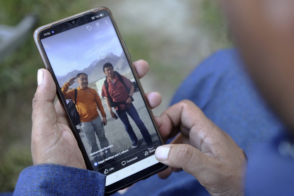 Japanese climbers Semba Takayasu and Shinji Tamura are seen in a picture on a Pakistani guide’s smartphone in Skardu on Tuesday. Photo: AP