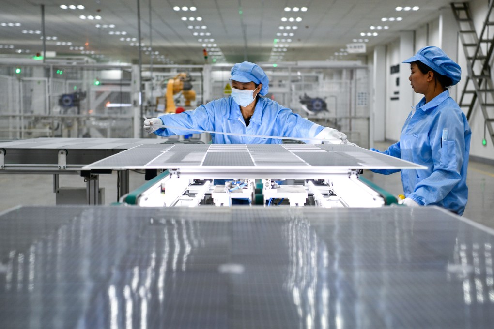 Workers produce photovoltaic modules at a company in southwest Guizhou province. China is seen dominating the green energy supply chain for the foreseeable future, according to analysts. Photo: Xinhua