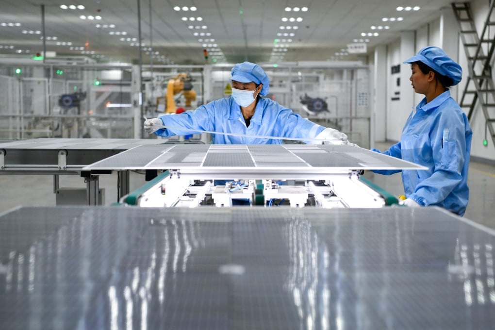 Workers produce photovoltaic modules at a company in southwest Guizhou province. China is seen dominating the green energy supply chain for the foreseeable future, according to analysts. Photo: Xinhua