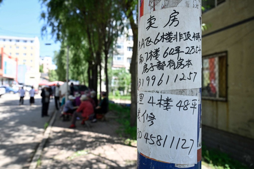 An advertisement for an apartment for sale is posted on a telegraph pole in a residential compound in Hegang city in northeastern China’s Heilongjiang province on July 4. Retail sales data in July showed that Chinese consumers were still spending in sectors such as catering, but they are cutting back on housing-related spending. Photo: AFP