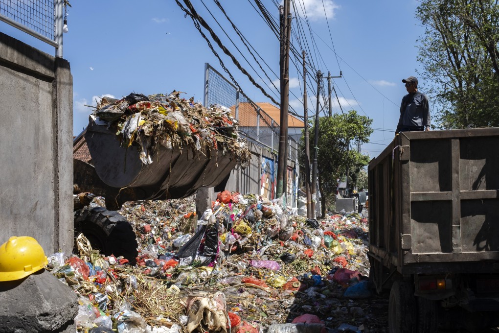 A landfill bulldozer is used to remove piles of rubbish at a dump site in Bali, Indonesia. Photo: EPA-EFE