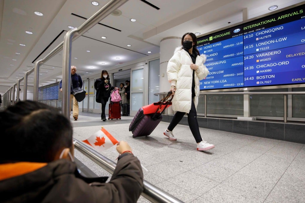 Travellers are seen at the international arrivals area at the Toronto Pearson Airport in Canada in January 2020. Photo: AFP