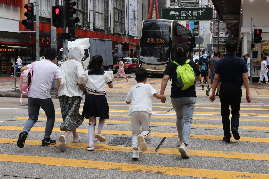 Pedestrians cross the road against a red signal in Mong Kok on August 14. The city’s police force has said it will step up enforcement action against unsafe behaviour by pedestrians and drivers after a series of accidents. Photo: Yik Yeung-man