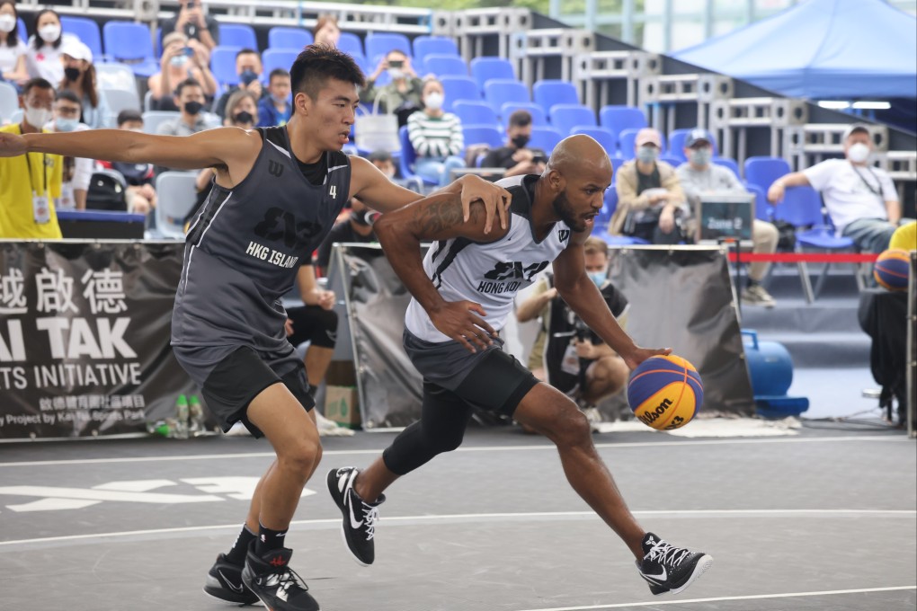 Yiu Pong-yip and Bryant Austin in action at the 2022 FIBA 3X3 World Tour Masters match between Hong Kong (white) and Hong Kong Island (grey), at Victoria Park in Causeway Bay. Photo: Jonathan Wong