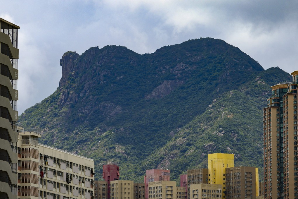 The Lion Rock trekking trail towers over nearby buildings in Hong Kong. Photo: Dickson Lee