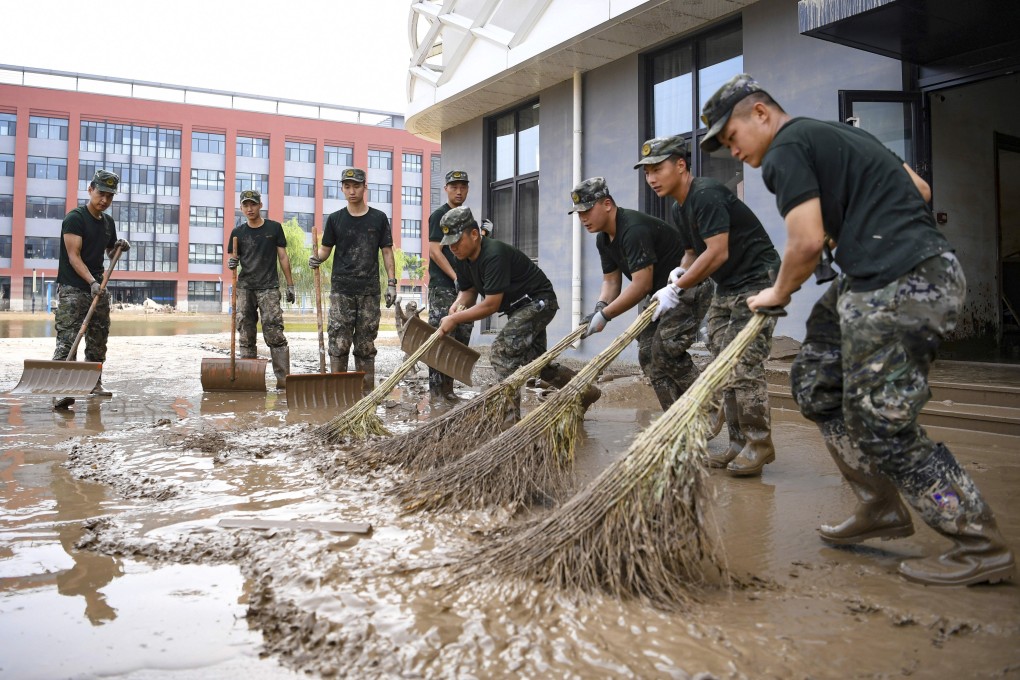 The clean-up effort is under way in China after record flooding but now is not the time to relax, with floods season not yet over. Photo: AP