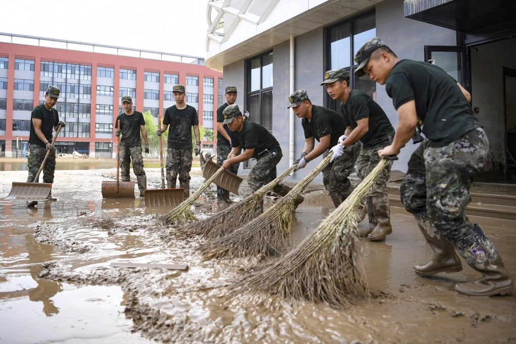 The clean-up effort is under way in China after record flooding but now is not the time to relax, with floods season not yet over. Photo: AP