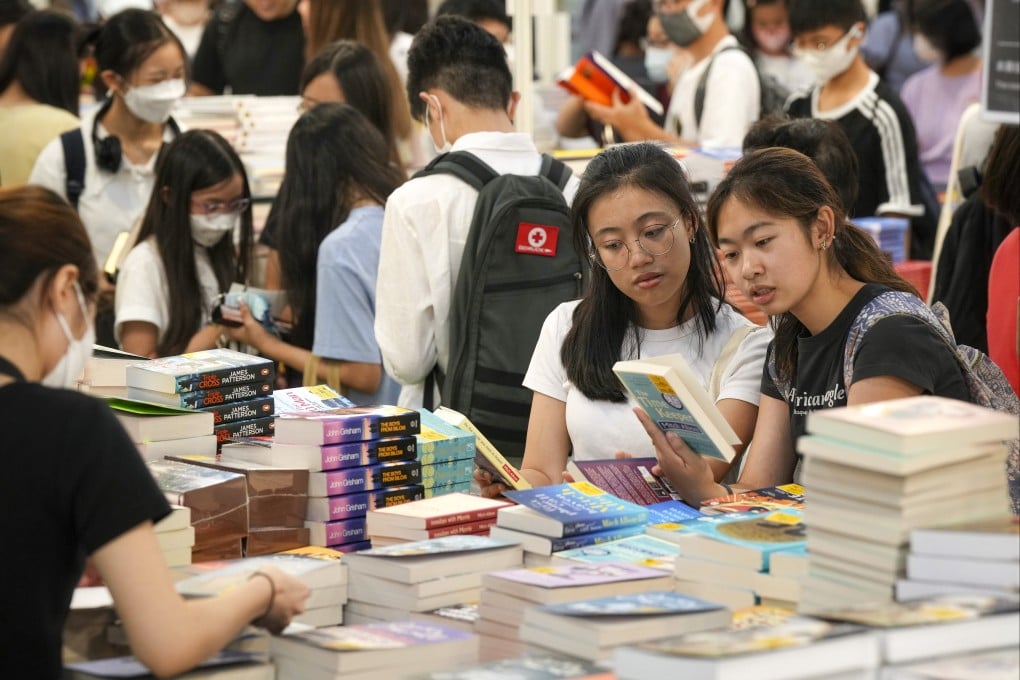 Readers shop for books on the first day of Hong Kong Book Fair on July 19 at the Convention and Exhibition Centre in Wan Chai. Photo: Elson Li