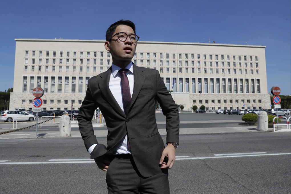 Wanted activist Nathan Law protests outside a meeting in Rome between Chinese foreign minister Wang Yi and his Italian counterpart Luigi Di Maio three years ago. Photo: AP.