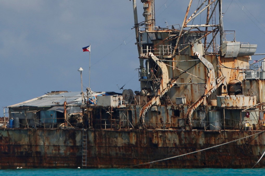 A Philippine flag flutters onboard the BRP Sierra Madre, a marooned transport ship which Philippine Marines used as a military outpost, in the disputed Second Thomas Shoal, part of the Spratly Islands in the South China Sea March. Photo: Reuters