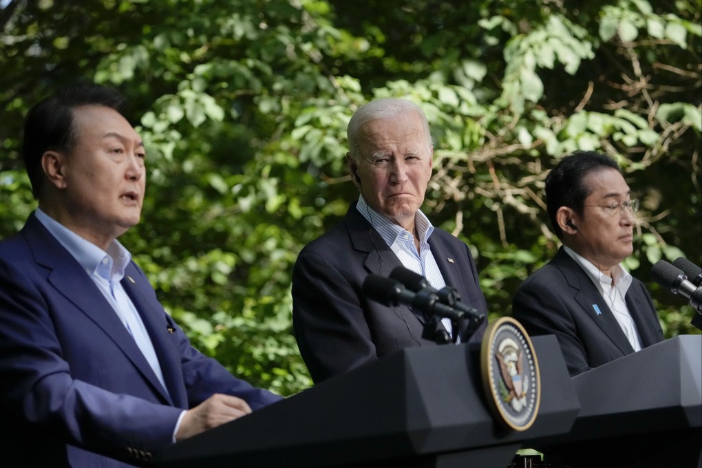 South Korea’s President Yoon Suk-yeol, left, speaks during a joint news conference with US President Joe Biden, center, and Japan’s Prime Minister Fumio Kishida on August 18, 2023, at Camp David. Photo: AP