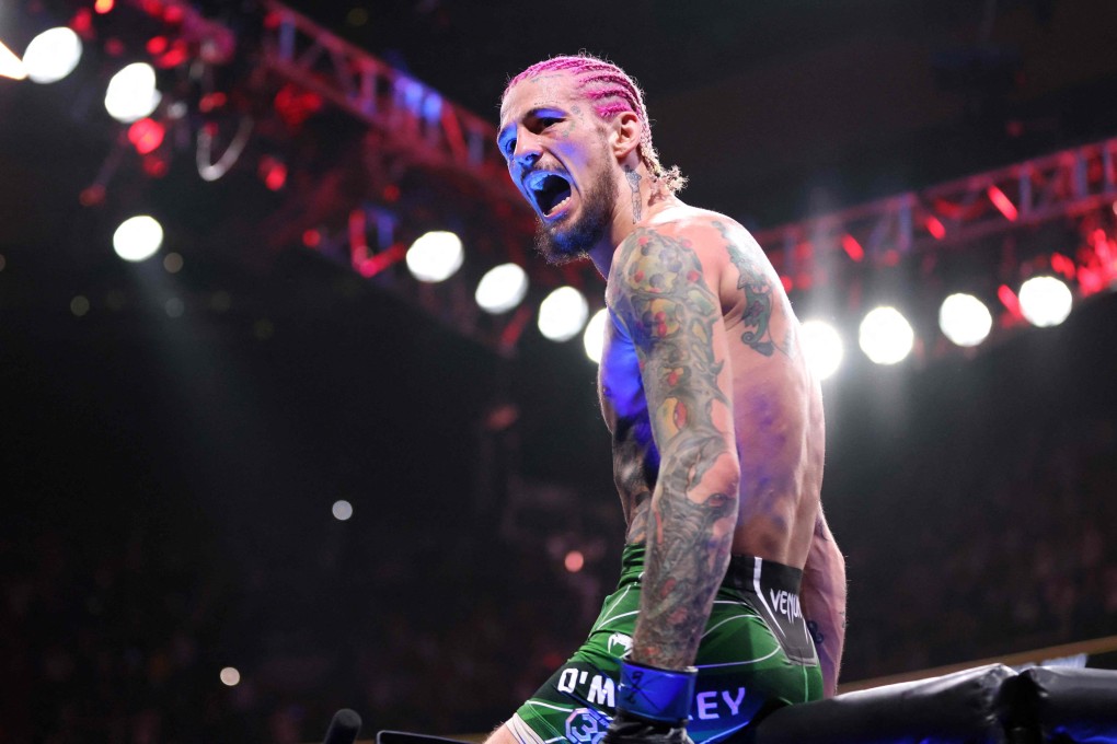 Sean O’Malley celebrates after defeating Aljamain Sterling at UFC 292. Photo: AFP