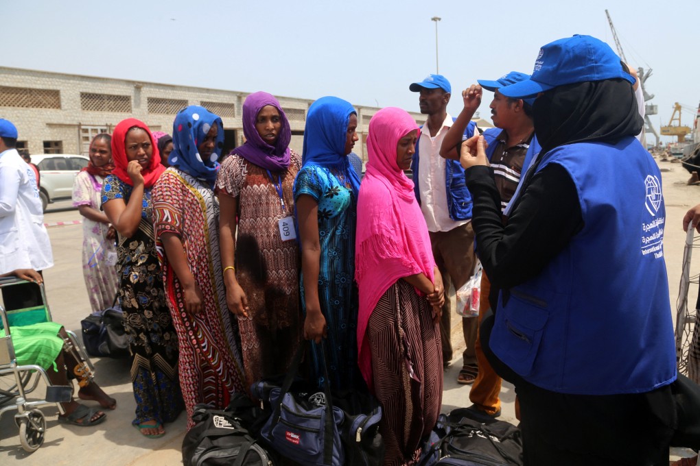 Employees of the International Organisation for Migration (IOM) assist Ethiopian migrants to board a ship repatriating them home in Yemen’s rebel-held Red Sea port of Hodeida in 2018. File photo: AFP