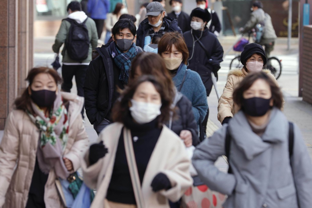 Peoplein the Tenjin business and commercial area in Fukuoka, southwestern Japan. Photo: Kyodo