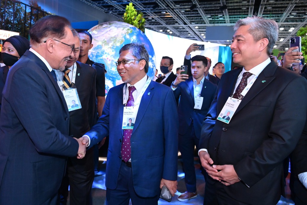 Malaysian Prime Minister Anwar Ibrahim (left) with Datuk Bacho Pilong, senior vice-president of project delivery and technology at Petronas, during a tour of the exhibits at Energy Asia 2023 in Kuala Lumpur.