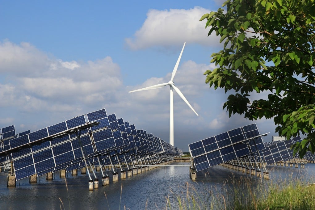 Aerial view of a hybrid power station consisting of wind turbines, solar panels and fish ponds in Dongtai, Jiangsu Province of China. Photo: Getty Images