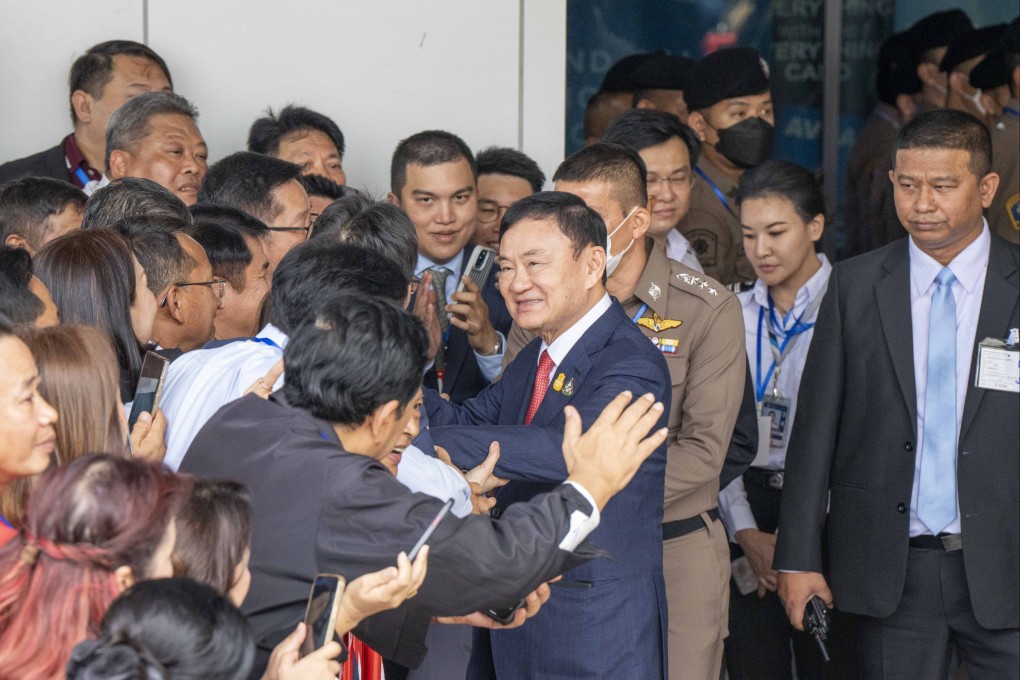 Thaksin Shinawatra greets supporters at Bangkok’s Don Mueng International airport upon returning to Thailand for the first time in 15 years, 22 August, 2023. Photo: dpa