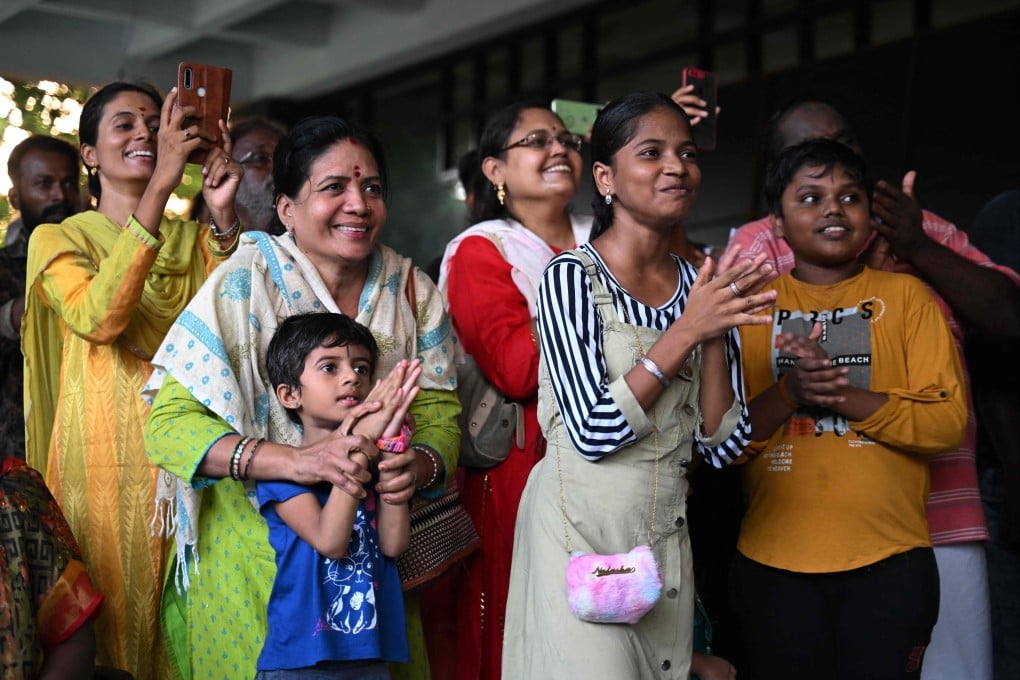 People in Chennai, India, celebrate the successful landing of the Chandrayaan-3 spacecraft on the south pole of the moon. Photo: AFP