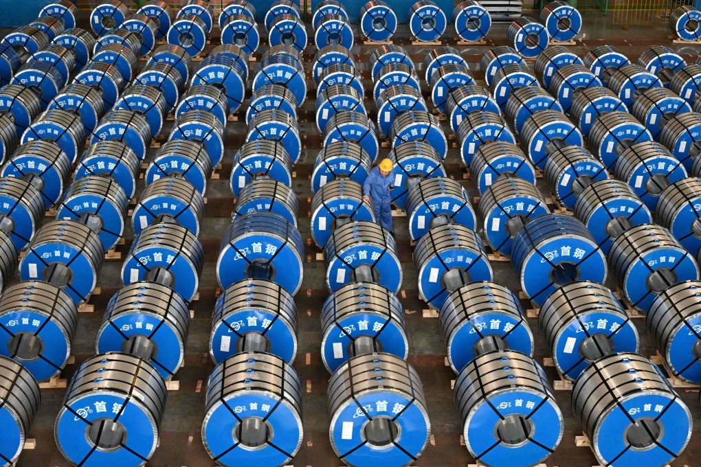 An employee works at Shougang Jingtang United Iron & Steel’s warehouse in Tangshan, Hebei province, on July 22. For carmakers, the first step to reducing their steel-related emissions is to disclose them. Photo: Xinhua