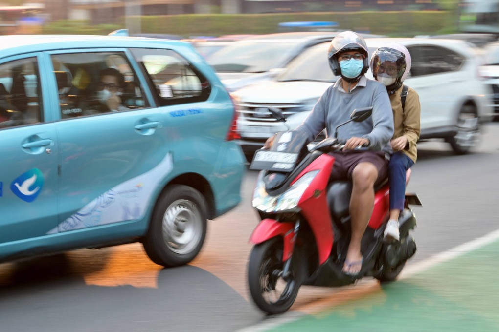 Indonesians wear face masks due the high level of pollution in Jakarta on Tuesday. Photo: AFP