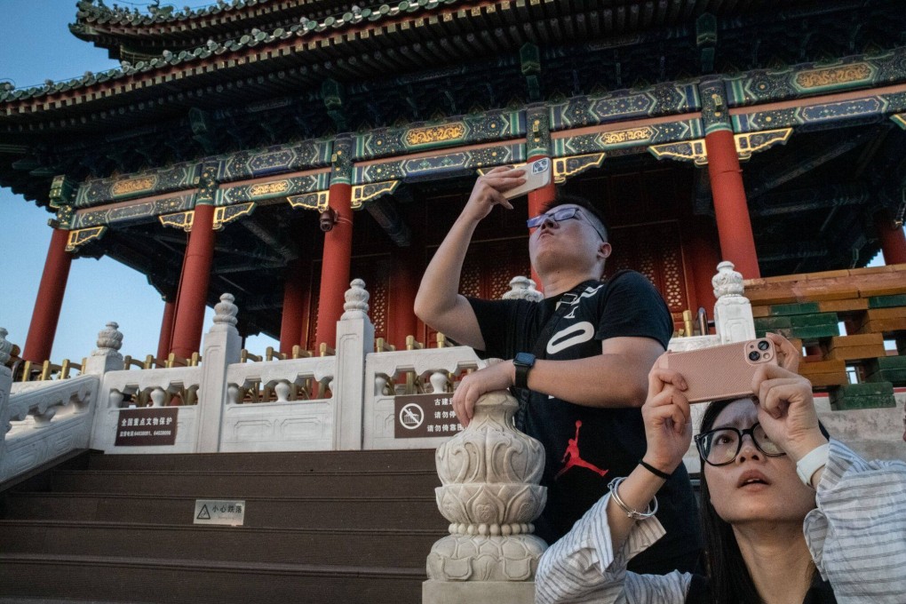 Visitors at Jingshan Park near the Forbidden City in Beijing. Photo: Bloomberg