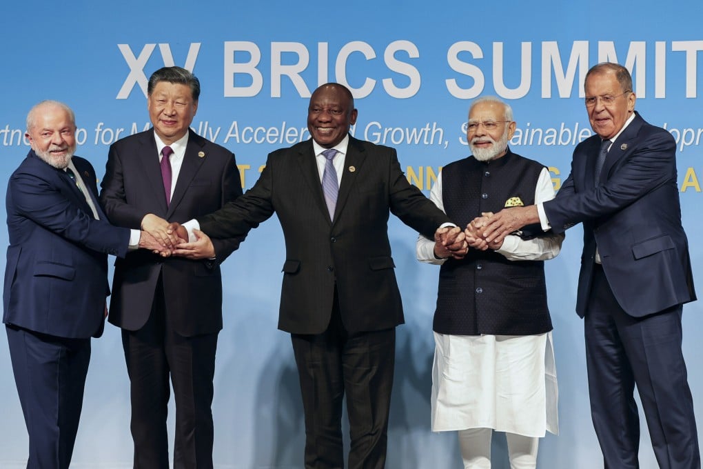 From the left, Brazilian President Luiz Inacio Lula da Silva, Chinese President Xi Jinping, South African President Cyril Ramaphosa, Indian Prime Minister Narendra Modi and Russian Foreign Minister Sergei Lavrov pose for a group photo during the Brics Summit in Johannesburg, South Africa, on August 23. Photo: AP