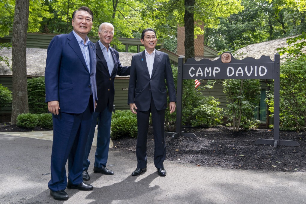 US President Joe Biden greets South Korea’s President Yoon Suk-yeol, left, and Japan’s Prime Minister Fumio Kishida, right, at the Camp David summit, which has angered China. Photo: AP