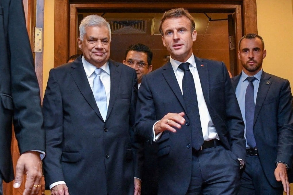 France’s President Emmanuel Macron chats with Sri Lankan President Ranil Wickremesinghe during an overnight stopover in Colombo last month.Photo: President Media/Handout via Reuters