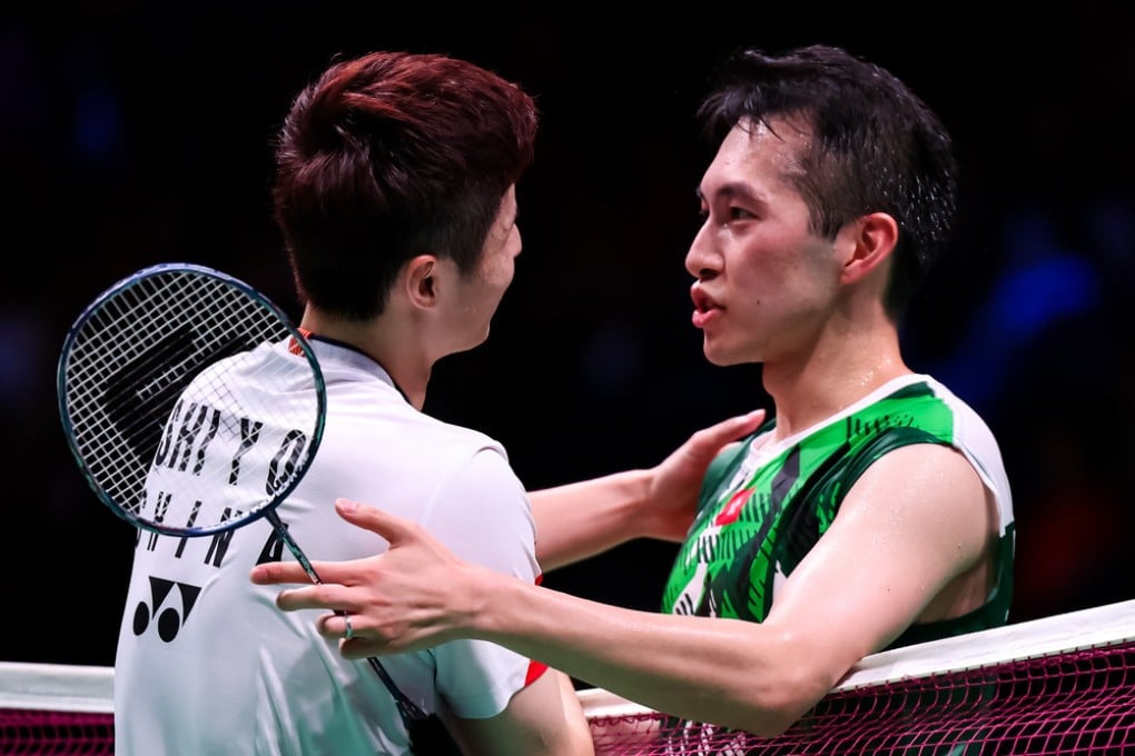 Shi Yuqi commiserates with Angus Ng after their hour-long battle. Photo: Badmintonphoto
