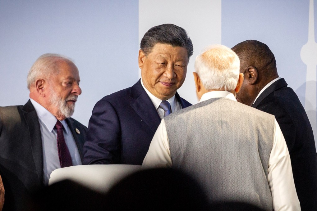 Chinese President Xi Jinping (centre) listening to Indian Prime Minister Narendra Modi at a Brics event on Thursday. Photo: EPA-EFE