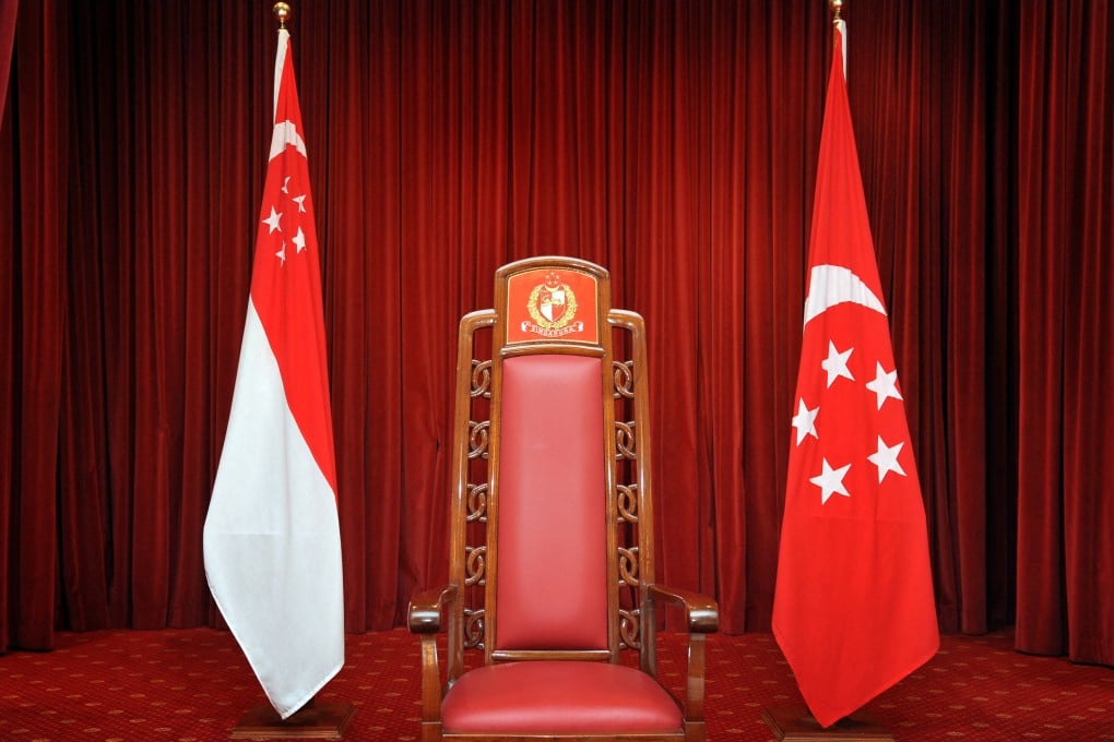 The Presidential chair, flanked by the Singapore flag (left) and the Presidential Standard (right) at the Istana. Photo: SPH Media via AFP