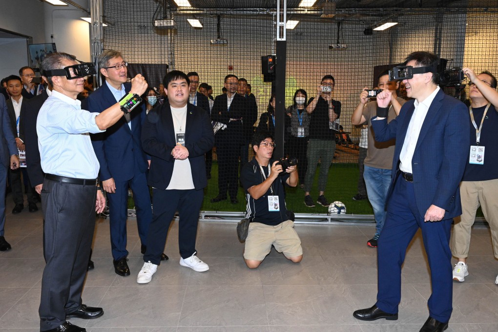 Financial Secretary Paul Chan (left) tried his hand at virtual reality at the Digital Entertainment Leadership Forum over the weekend. Photo: Handout