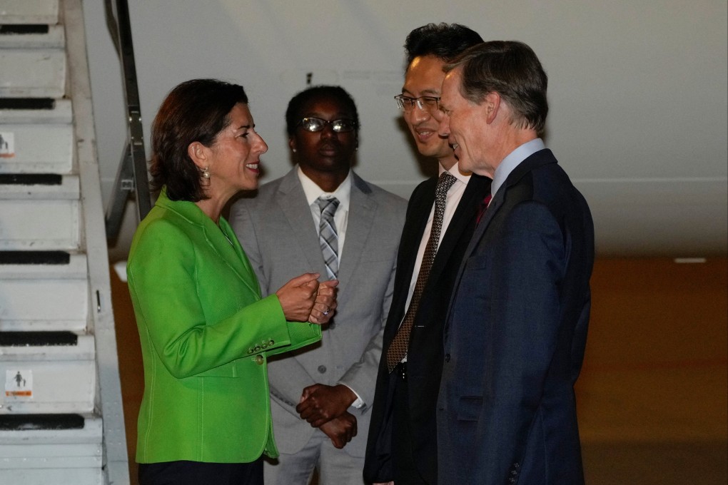 US Commerce Secretary Gina Raimondo is greeted at Beijing Capital International Airport by Lin Feng, director of the Ministry of Commerce’s American and Oceania affairs department, as US ambassador to China Nick Burns looks on on Sunday. Photo: Reuters