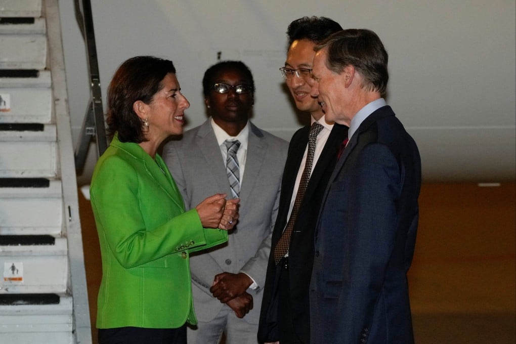 US Commerce Secretary Gina Raimondo is greeted at Beijing Capital International Airport by Lin Feng, director of the Ministry of Commerce’s American and Oceania affairs department, as US ambassador to China Nick Burns looks on on Sunday. Photo: Reuters