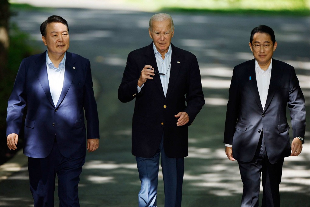From the left, South Korean President Yoon Suk-yeol, US President Joe Biden and Japanese Prime Minister Fumio Kishida arrive for a joint news conference following three-way talks at Camp David, Maryland, on August 18. Photo: Getty Images/AFP