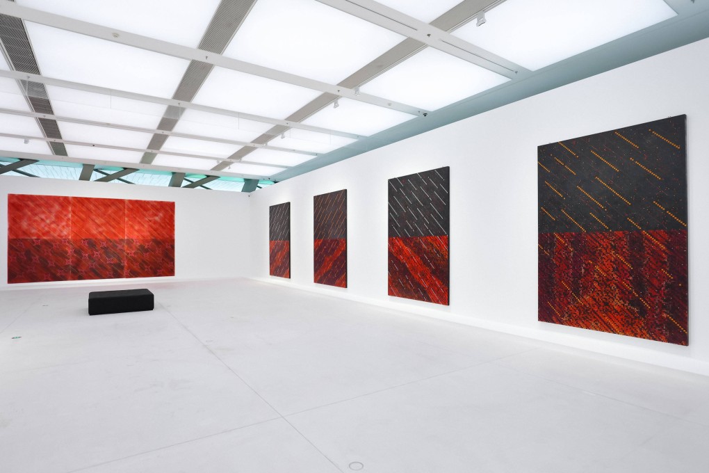 Works by Chinese abstract artist Ding Yi featured in “Cross Galaxy”, a restropective at the Shenzhen Museum of Contemporary Art and Urban Planning covering 35 years of his work that shows the evolution of his canvases full of plus signs and the letter x. Photo: Mocaup