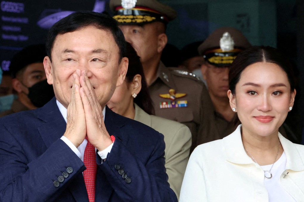 Former Thai Prime Minister Thaksin Shinawatra beside his daughter Paetongtarn Shinawatra at Don Mueang airport in Bangkok on August 22. Photo: Reuters