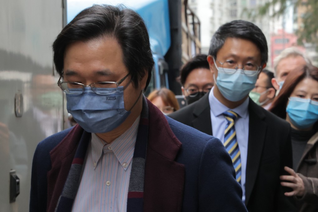 Chan Siu-kim (left) and Lam Chi-kwan (middle) leave Eastern Court in Sai Wan Ho. Photo: Jelly Tse