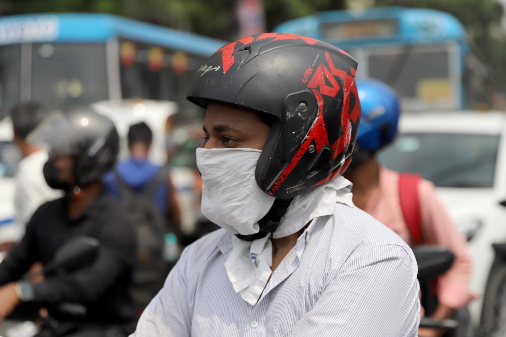 An Indian commuter wears a makeshift mask to guard against air pollution in Kolkata on Monday. India is responsible for about 59 per cent of the world’s increase in pollution since 2013, a new report found. Photo: EPA-EFE