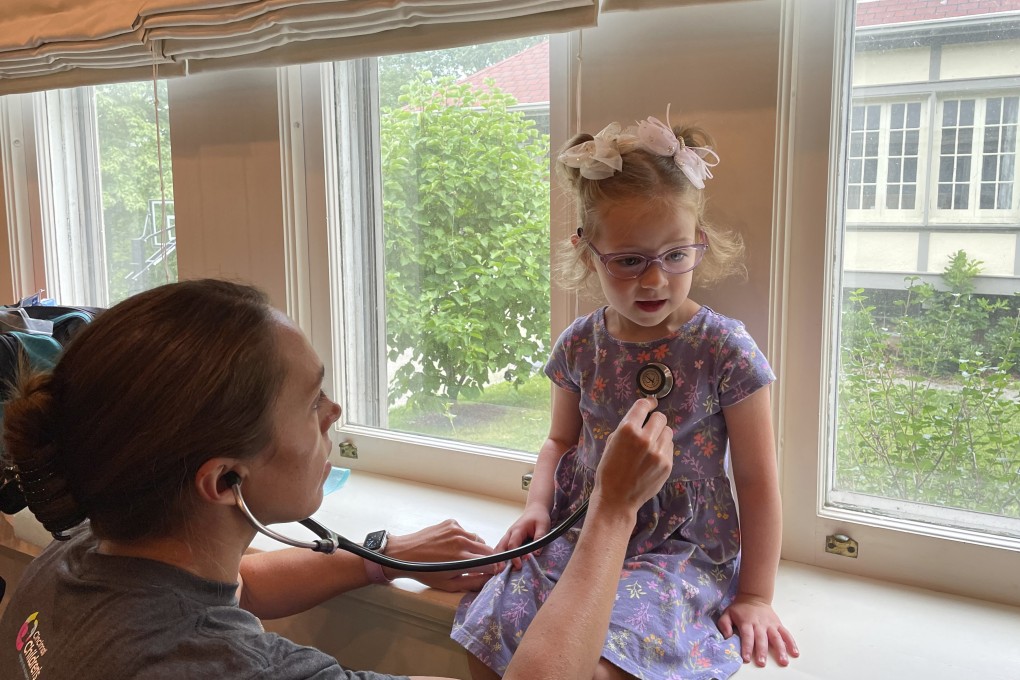 Brynn Schulte, now four years old but who almost died as a newborn, is examined at home before receiving medication for the rare genetic condition that whole genome testing discovered. Experts say such testing could save many more lives. Photo: AP
