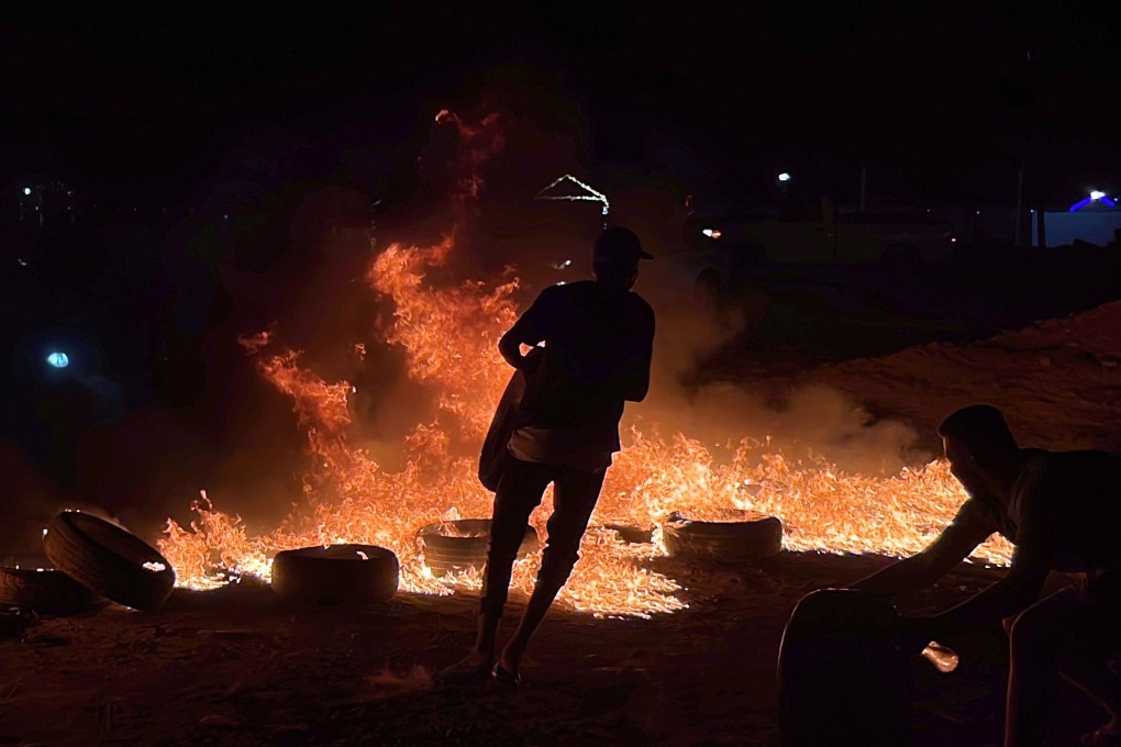 Libyans in Tripoli on Sunday burn tyres in protest against foreign minister Najla al-Mangoush’s meeting with her Israeli counterpart in Italy. Photo: EPA-EFE