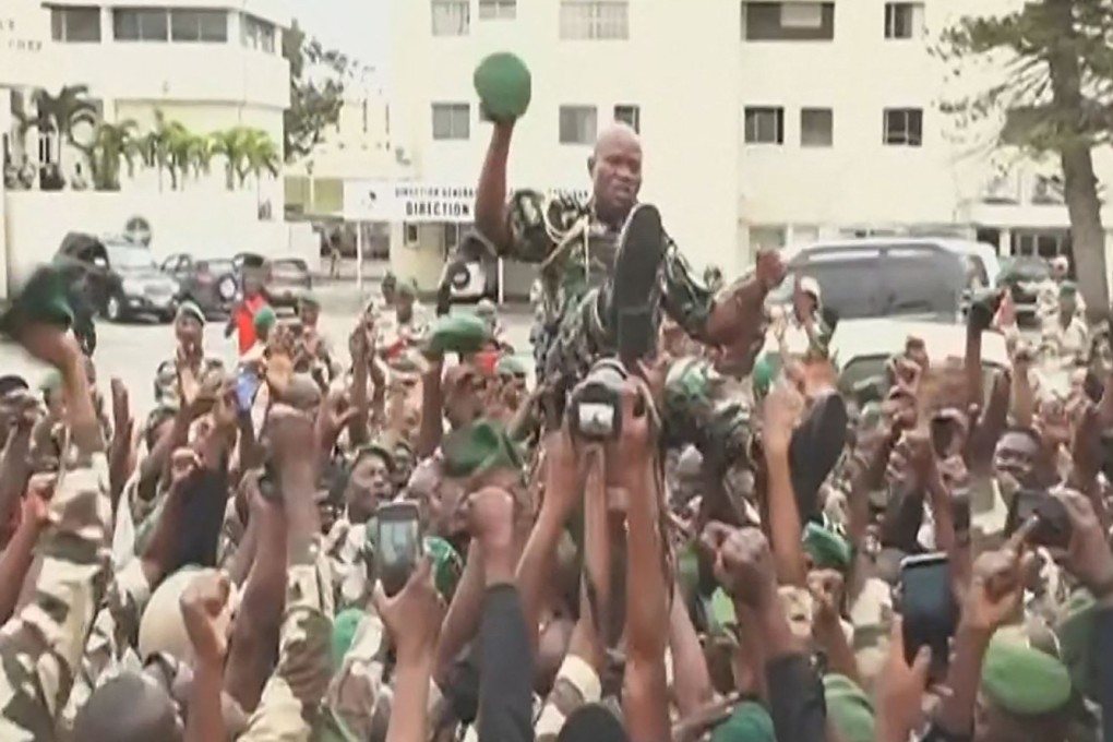 The head of Gabon’s presidential guard Brice Oligui Nguema carried aloft by hundreds of soldiers who have proclaimed him leader. Photo: AFP