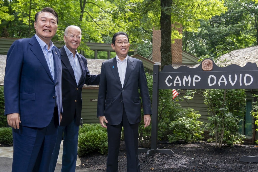 US President Joe Biden (centre) greeting South Korean President Yoon Suk-yeol (left) and Japanese Prime Minister Fumio Kishida on August 18 at Camp David in Maryland. Photo: AP