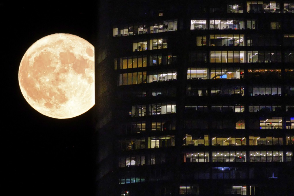 A supermoon passing behind a New York City skyscraper on August 1, . Photo: AP